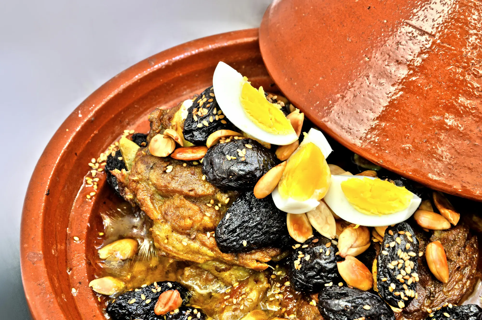 A vibrant scene of a traditional Moroccan tagine being prepared.